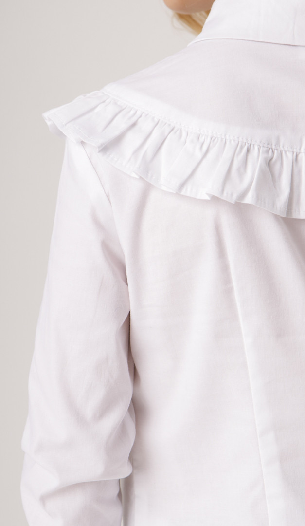 Фото bluzka-belaa-s-rusej-dla-devocki-05 товару Блузка біла з рюшею для дівчинки0